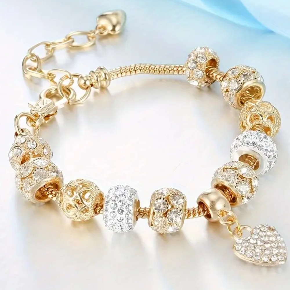 Elegant Gold and Silver Charm Bracelet